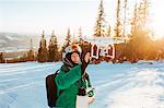 Man with a drone during winter in Osterdalen, Norway