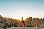 Woman standing on rocks in Joshua Tree National Park