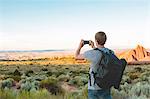 Man in Arches National Park photographing landscape