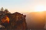 Man standing at edge of rock in Yosemite National Park