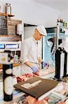 Butcher unwrapping meat in Sweden