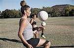 Women on football pitch playing football