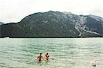 Couple waist deep in water, Achensee, Innsbruck, Tirol, Austria, Europe