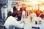 Blurred background with futuristic effect of business people during a meeting. double exposure