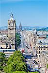 Busy traffic on Princes Street, city centre and Edinburgh skyline, Edinburgh, Midlothian, Scotland, United Kingdom, Europe