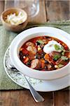 Black bean and sausage soup topped with sour cream