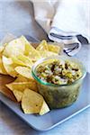 Tomatillo salsa served with corn tortilla chips