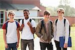 Portrait Of Male Teenage Students Walking Around College Campus