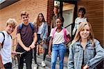 Portrait Of Teenage Students Outside School Building