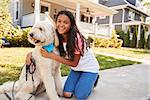 Portrait Of Girl With Dog On Suburban Street