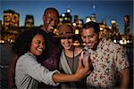 Group Of Friends Posing For Selfie In Front Of Manhattan Skyline