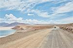 Recreational vehicle on empty road, Chiguana, Potosi, Bolivia, South America