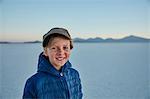 Portrait of boy on salt flats, Salar de Uyuni, Uyuni, Oruro, Bolivia, South America