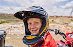 Portrait of boy wearing crash helmet, close-up, La Paz, Bolivia, South America