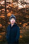 Portrait of boy, outdoors, looking away