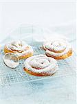 Ensaimadas (spiral pastries, Spain) dusted with icing sugar