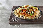 Thai-style chicken on a bed of rice noodles