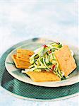 Spicy macadamia cheese crackers with courgette salad