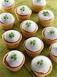 Cupcakes with a green shamrock on top of the white icing