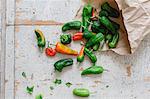 Fresh pimiento peppers in a paper bag (top view)