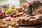 Various party snacks on a wooden table