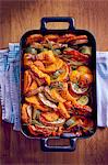 Roasted sweet potatoes and vegetables in an oven dish