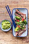 Steak with spinach leaves and a wasabi-avocado dip (Japan)