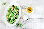 Grilled zucchini with feta cheese herbs and rocket