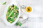 Grilled zucchini with feta cheese herbs and rocket