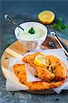 Lemon chicken cutlet with mayonnaise with yoghurt parsley and capers