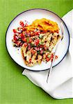 A grilled chop with salsa and sweet potato mash