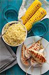 Grilled chicken with couscous and corn on the cob