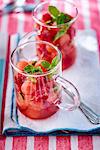 Watermelon and raspberry dessert with pistachios and fresh mint