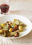 Small potatoes, artichokes and mushrooms with parsley
