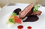 Roasted duck breast with black rice, grapefruit and fennel