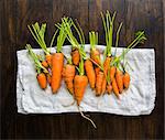 Small garden carrots in different shapes and sizes