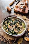 Soup with mushrooms, sausage and kale