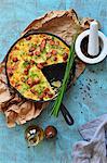 Paella in a pan with potatoes and sausages