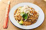 Pad thai stir fried noodles with prawns, chilli, beans, sprouts, spring onions, carrots, crab meat, shredded apple, lime and peanut