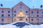 Facade of the Simplon Pass Hospice during twilight. Simplon Pass, Canton of Valais/Wallis, Switzerland.