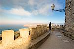 Tourist looking up to panoramic view at Venus castle, Erice, Trapani province, Sicily, Italy