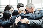 Mixed race group of business people in an informal team building meeting.