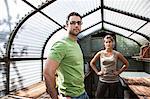 Hispanic couple in their new greenhouse