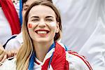British football fan smiling cheerfully, portrait