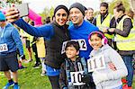 Family charity run runners taking selfie with camera phone