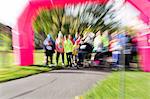 Defocused view of runners ready at charity run starting line