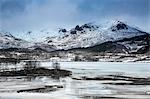 Tranquil snow covered mountains above fjord, Kavasen, Langoya, Vesteralen, Norway