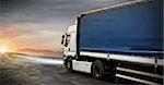 White fast truck transport delivers packages at sunset