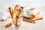 Italian cranberry almond biscotti  and cup of coffee on background