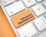Business Concept: Enterprise Development on the Conceptual Keyboard lying on the Orange Background. Text on Keyboard Enter Key, for Enterprise Development Concept. 3D Render.